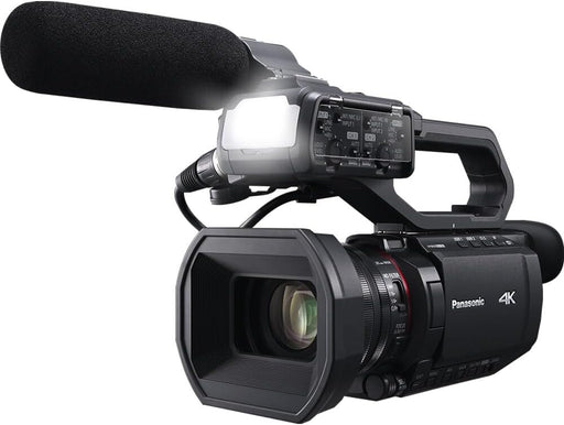 Panasonic HC-X2100 UHD 4K 3G-SDI/HDMI Pro Lightweight Camcorder with 24x Zoom (HC-X2100) + Pro Mic + Monitor + Pro Headphones + Case + LED Light + Tripod + 2 x 64GB Memory Card + USB-C Cable + More